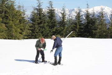 PUD workers measure snowpack
